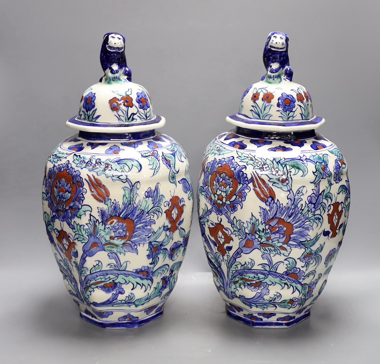 A pair of Belgian keramis jars and covers, 41cm